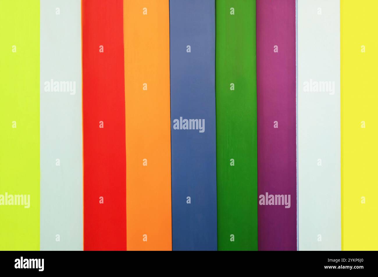 Vibrant multi-colored vertical striped wooden wall Stock Photo