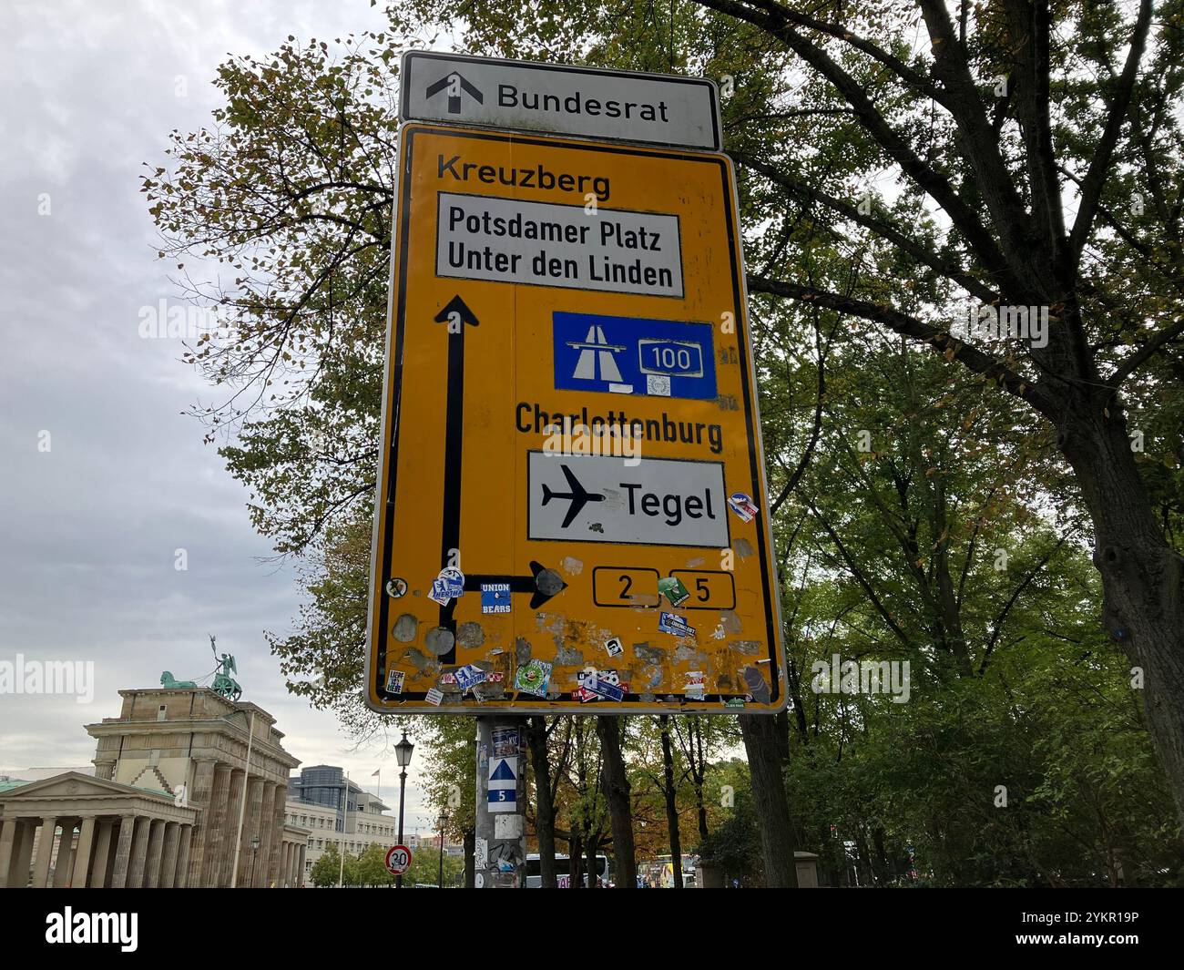 Road Sign with directions to Kreuzberg, Potsdamer Platz, Charlottenburg, and the now closed Tegel Airport. Mitte, Berlin, Germany. 6th October 2023. - Smartphone Captured Stock Image