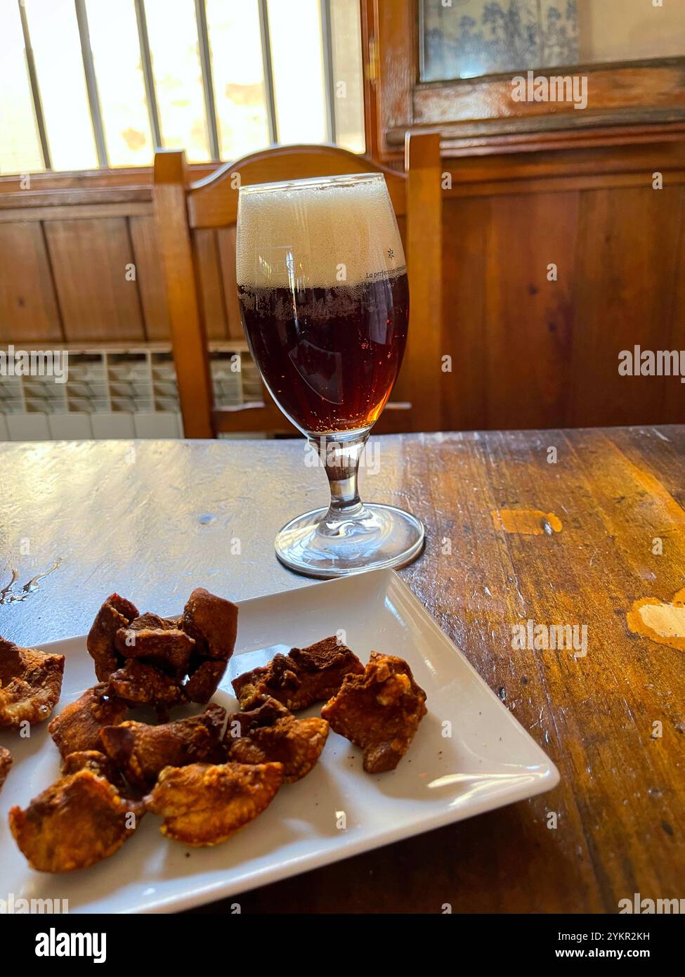 Glass of beer and torreznos in a tavern. Spain. - Smartphone Captured Stock Image