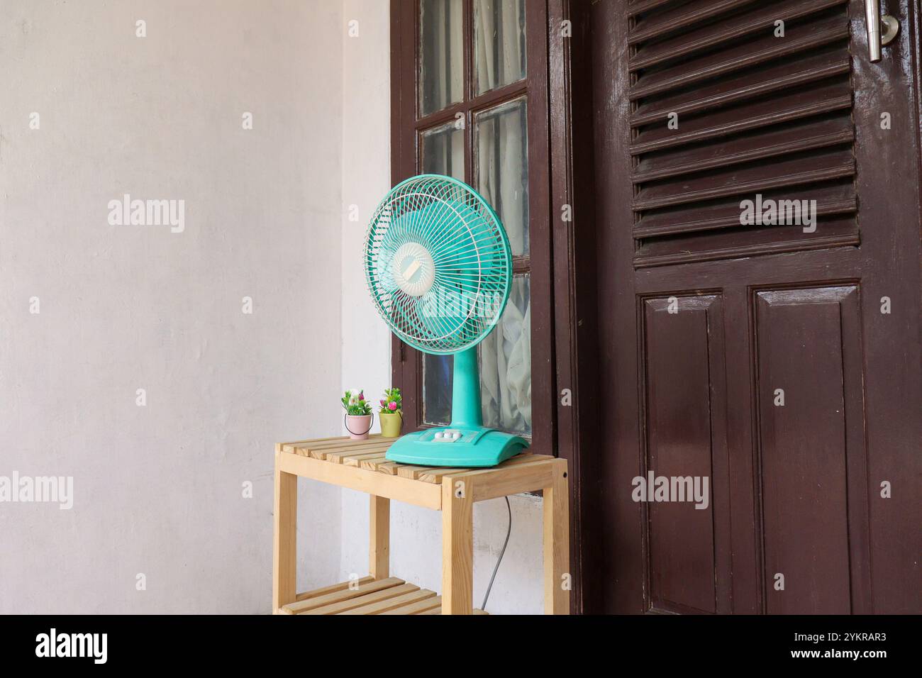 Table fan placed on the terrace Stock Photo