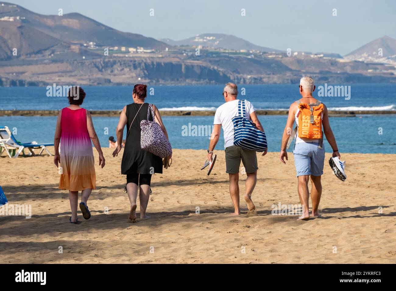 Gran Canaria, Canary Islands, Spain, 19th November 2024. Tourists, many British, escaping the UK winter weather, bask in glorious sunshine on the city beach in Las Palmas, the capital of Gran Canaria. Credit: Alan Dawson/Alamy Live News. Stock Photo