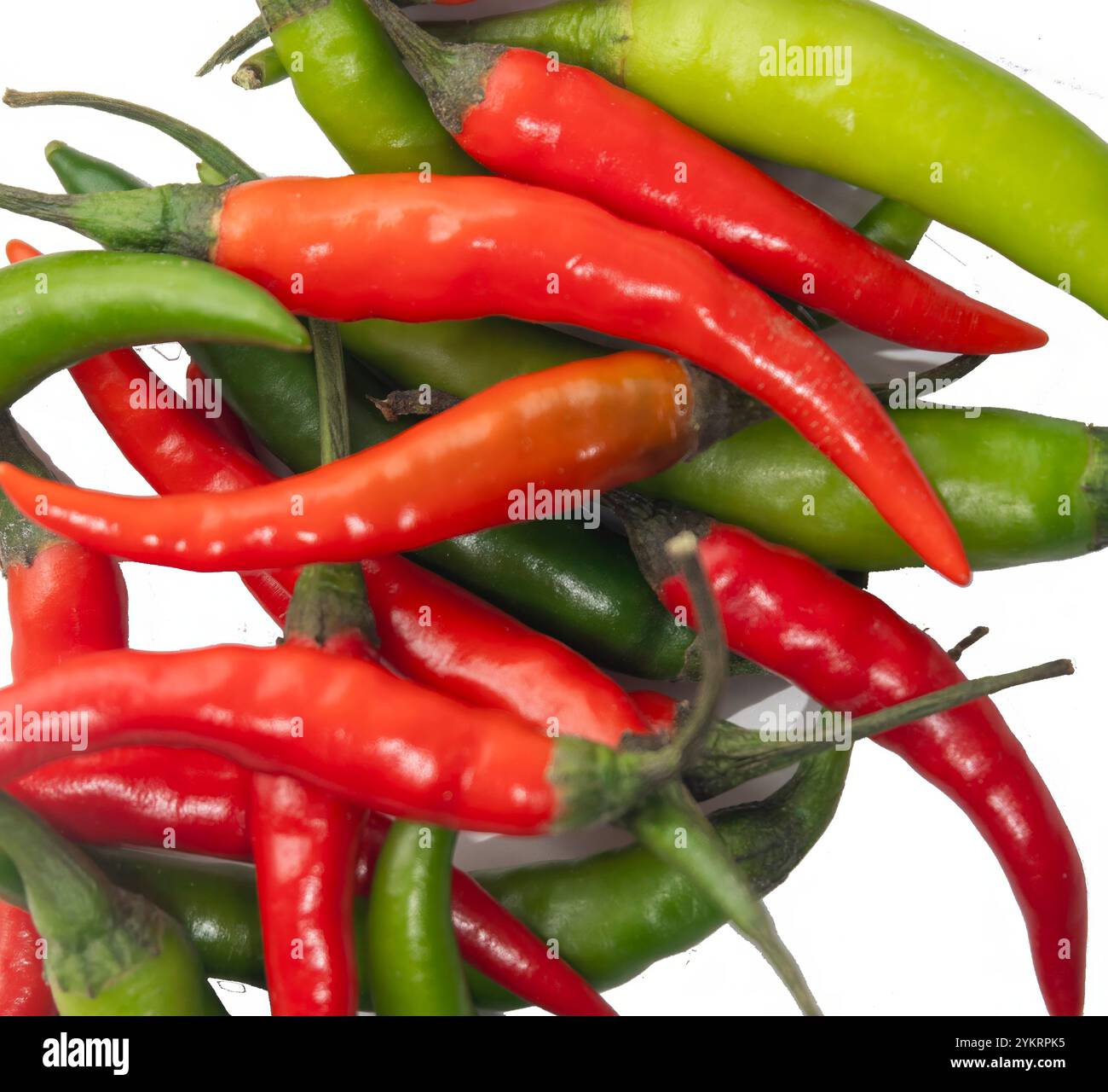 Red and green chili peppers shot from above on a white background Stock ...