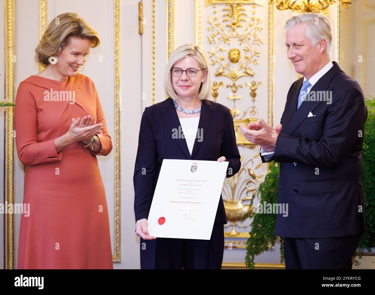 Brussels, Belgium. 19th Nov, 2024. Queen Mathilde of Belgium, Widukind Stockmans of Studio Pieter Stockmans (Belgian hand-crafted hard porcelain) and King Philippe - Filip of Belgium pose for the photographer during a royal reception with the newly appointed suppliers holding a 'Royal warrant of appointment' (Brevet van Hofleverancier - Brevet de Fournisseurs de la cour), at the Royal Palace, in Brussels, Tuesday 19 November 2024. BELGA PHOTO BENOIT DOPPAGNE Credit: Belga News Agency/Alamy Live News Stock Photo