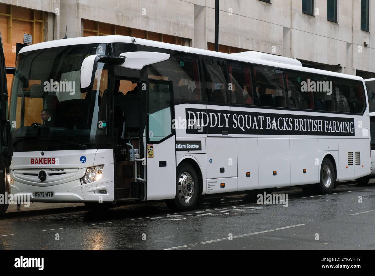 London, UK. 19th November, 2024. A coach organised by TV presenter Jeremy Clarkson to ferry farming rally attendees from Diddly Squat farm to Whitehall is parked up in Westminster. Thousands of agricultural workers and supporters attended a demonstration against new inheritance tax changes announced in Rachel Reeves' Autumn Budget. Credit: Eleventh Hour Photography/Alamy Live News Stock Photo