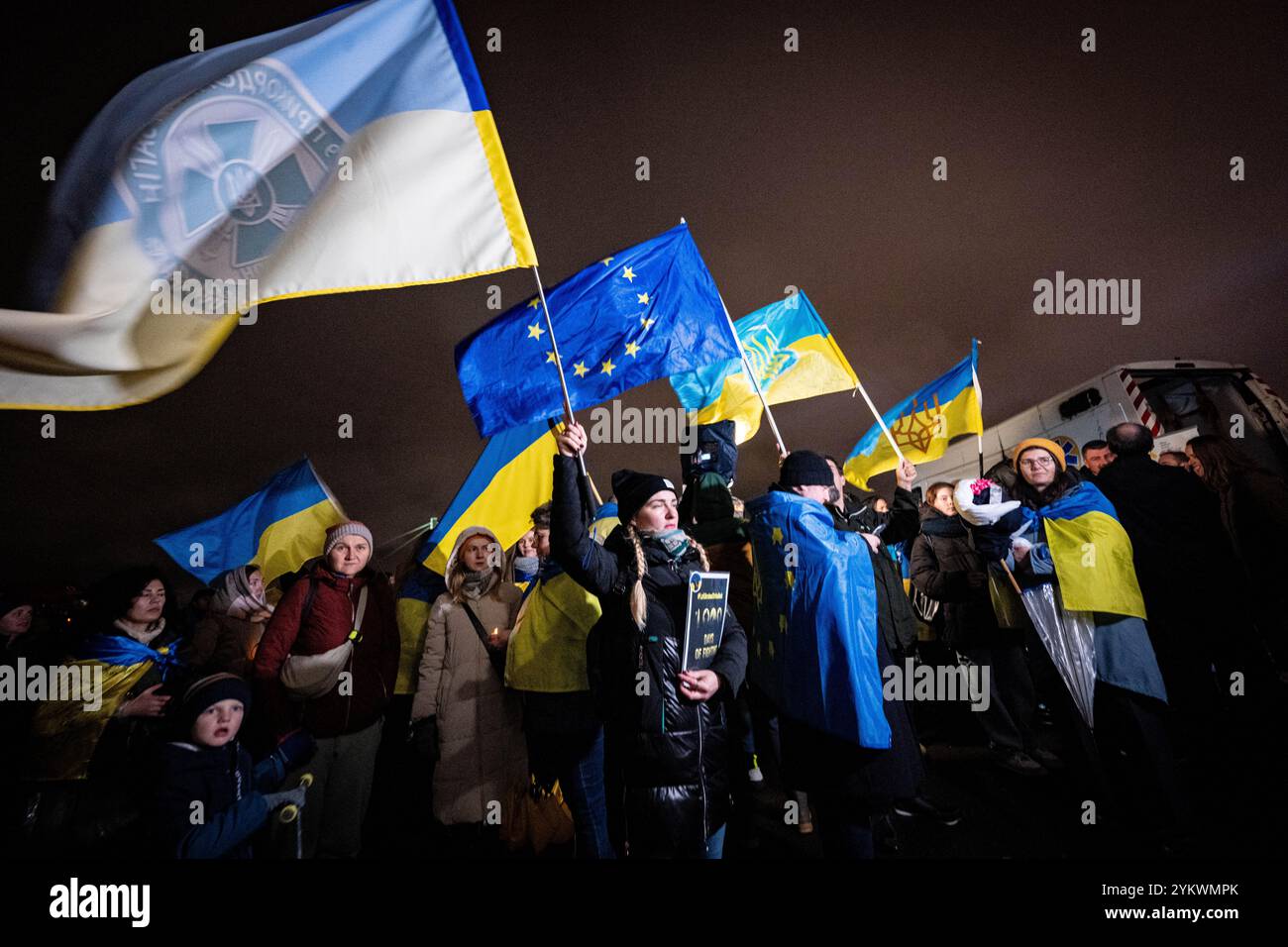 Cologne, Germany. 19th Nov, 2024. Participants in a solidarity demonstration by the German-Ukrainian association 'Blue-Yellow Cross' waving flags to mark '1000 days of full Russian invasion'. Credit: Benjamin Westhoff/dpa/Alamy Live News Stock Photo