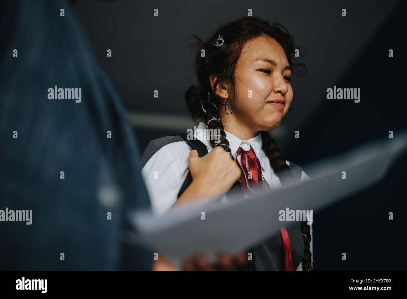 Students engaging with professor in an educational setting Stock Photo
