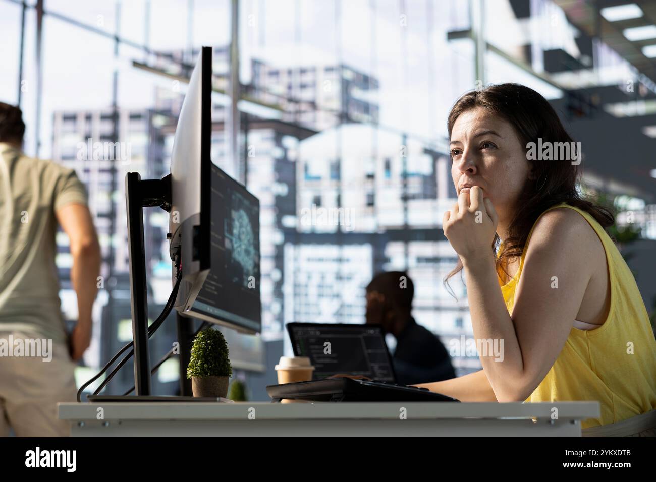 Data scientist developing and maintaining deep learning APIs solving complex problems. IT professional in office training predictive models capable of handling language processing tasks Stock Photo