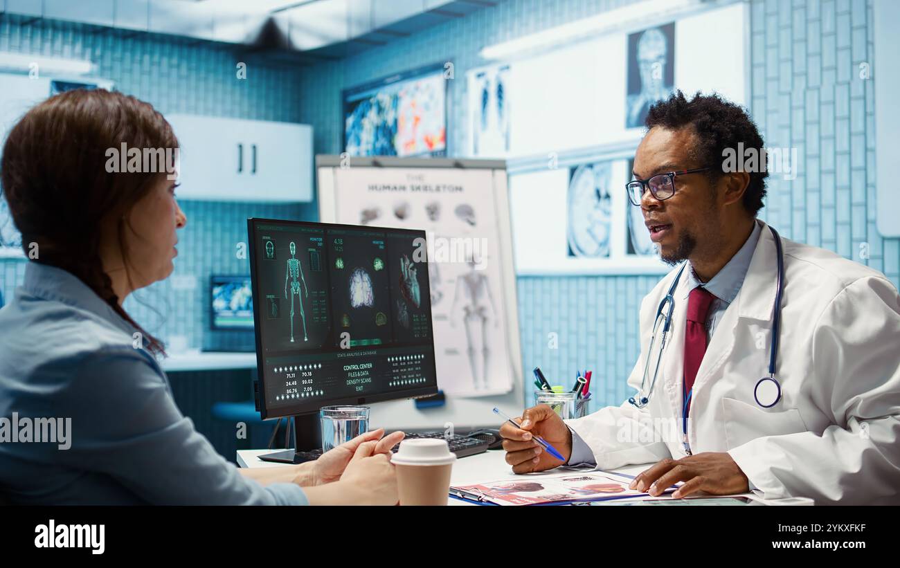 Professional medic analyzing x ray imaging and test findings in office ...