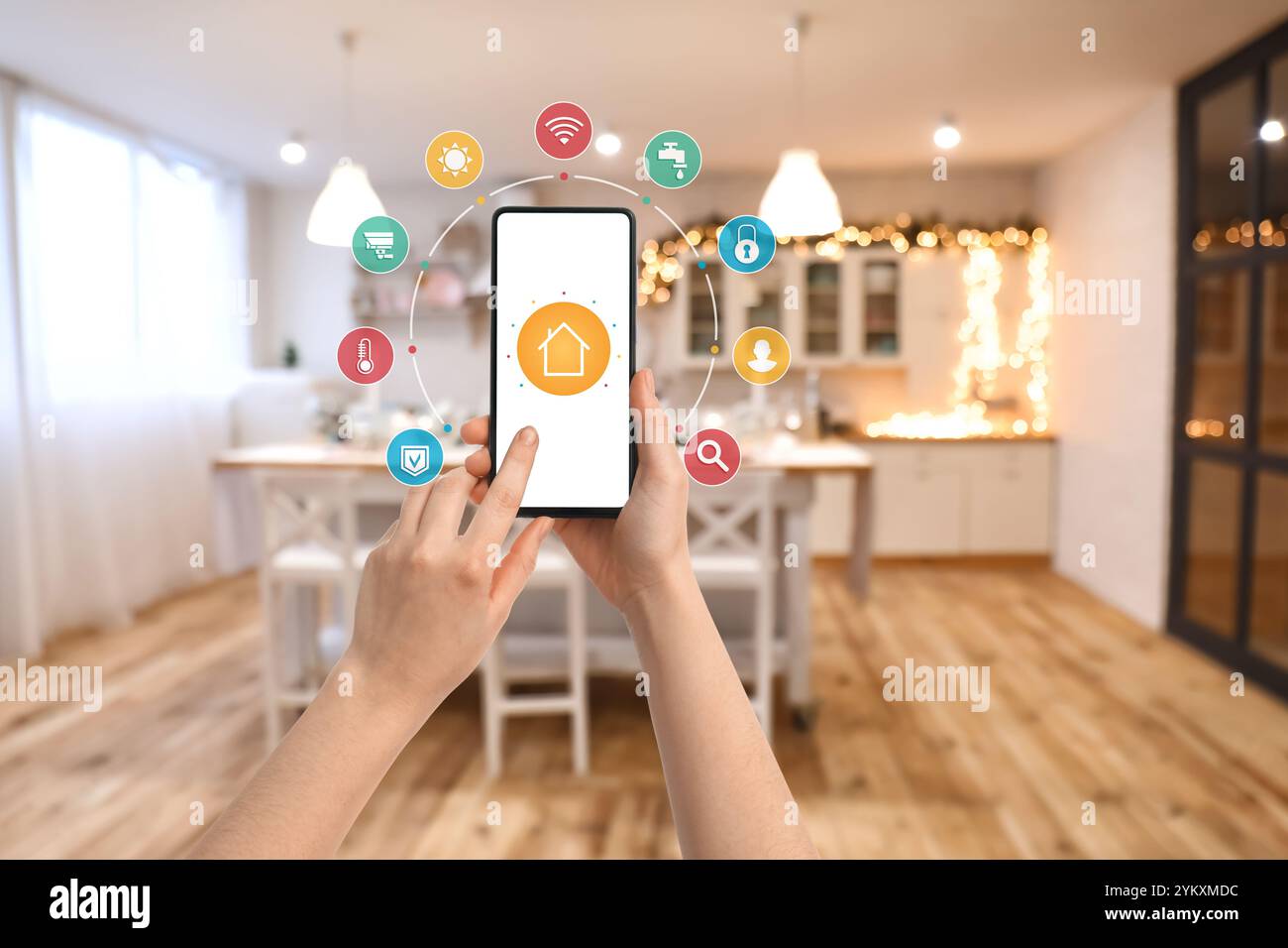 Hands holding mobile phone with open application of smart home ... - Home Kitchen Smartphone Automations