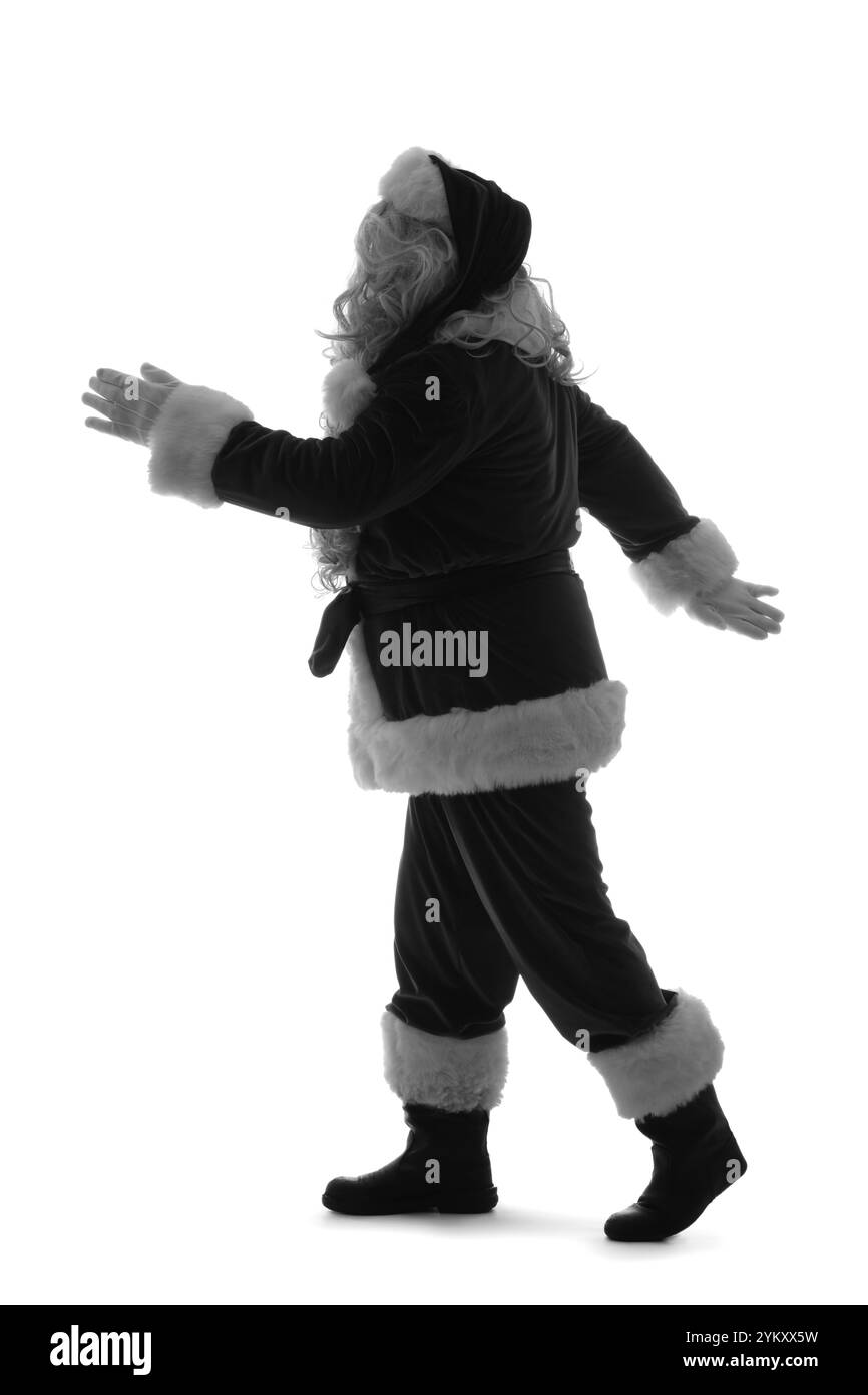 Silhouette of Santa Claus walking on white background Stock Photo - Alamy