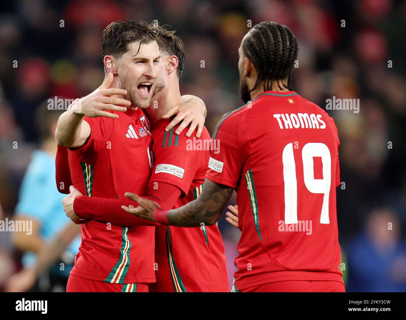 CARDIFF, UK. 26th Mar, 2024. Wales' Ben Davies celebrates victory with teammates Liam Cullen and Sorba Thomas after the 2024 European Championship Play-Off Final game between Wales and Poland at the Cardiff City Stadium on the 26th of March 2024 (Pic by John Smith/FAW) Credit: Football Association of Wales/Alamy Live News Stock Photo