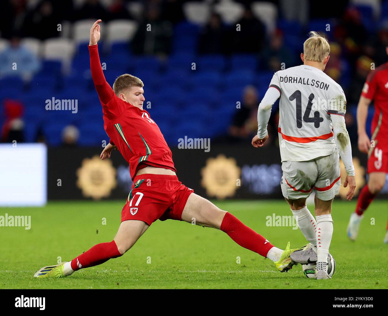 CARDIFF, UK. 26th Mar, 2024. Iceland's Dagur Dan Thorhallsson is challenged by Wales' Jordan James during the 2024 European Championship Play-Off Final game between Wales and Poland at the Cardiff City Stadium on the 26th of March 2024 (Pic by John Smith/FAW) Credit: Football Association of Wales/Alamy Live News Stock Photo