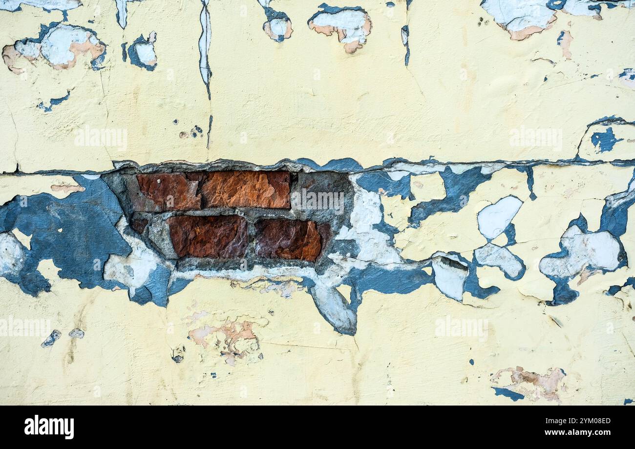 old rough wall background with cracks and bricks Stock Photo