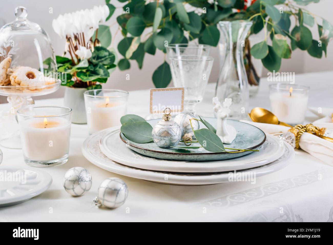 Traditional festive place setting for Christmas, decorated with eucalyptus branch Stock Photo