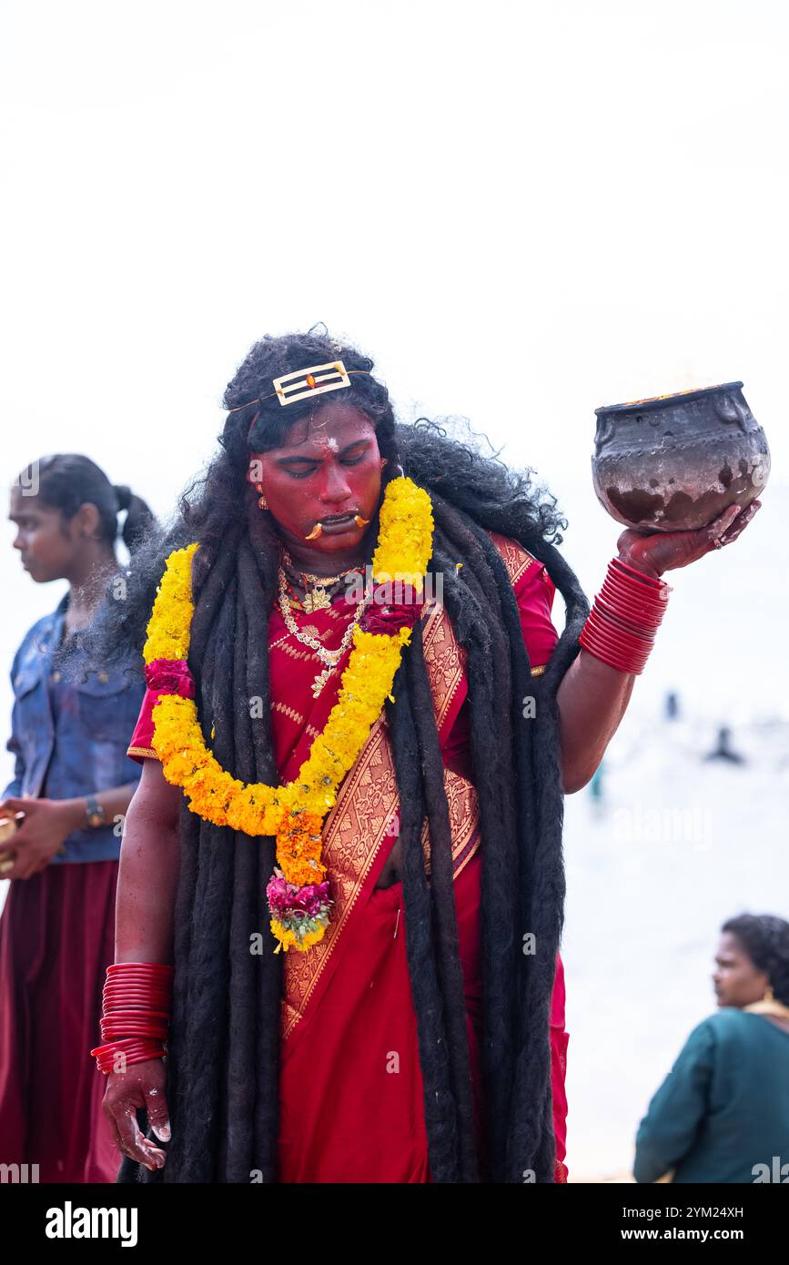 Kulasai Dasara, Portrait of indian hindu devotee with painted face and dressed as goddess kali to perform the rituals of kulasai dasara cult festival. Stock Photo