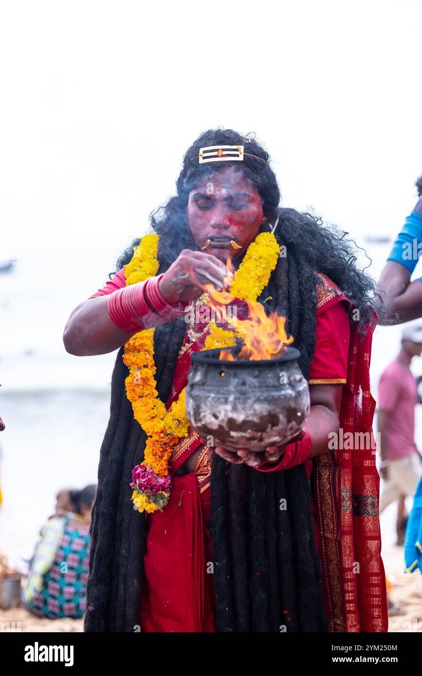 Kulasai Dasara, Portrait of indian hindu devotee with painted face and dressed as goddess kali to perform the rituals of kulasai dasara cult festival. Stock Photo