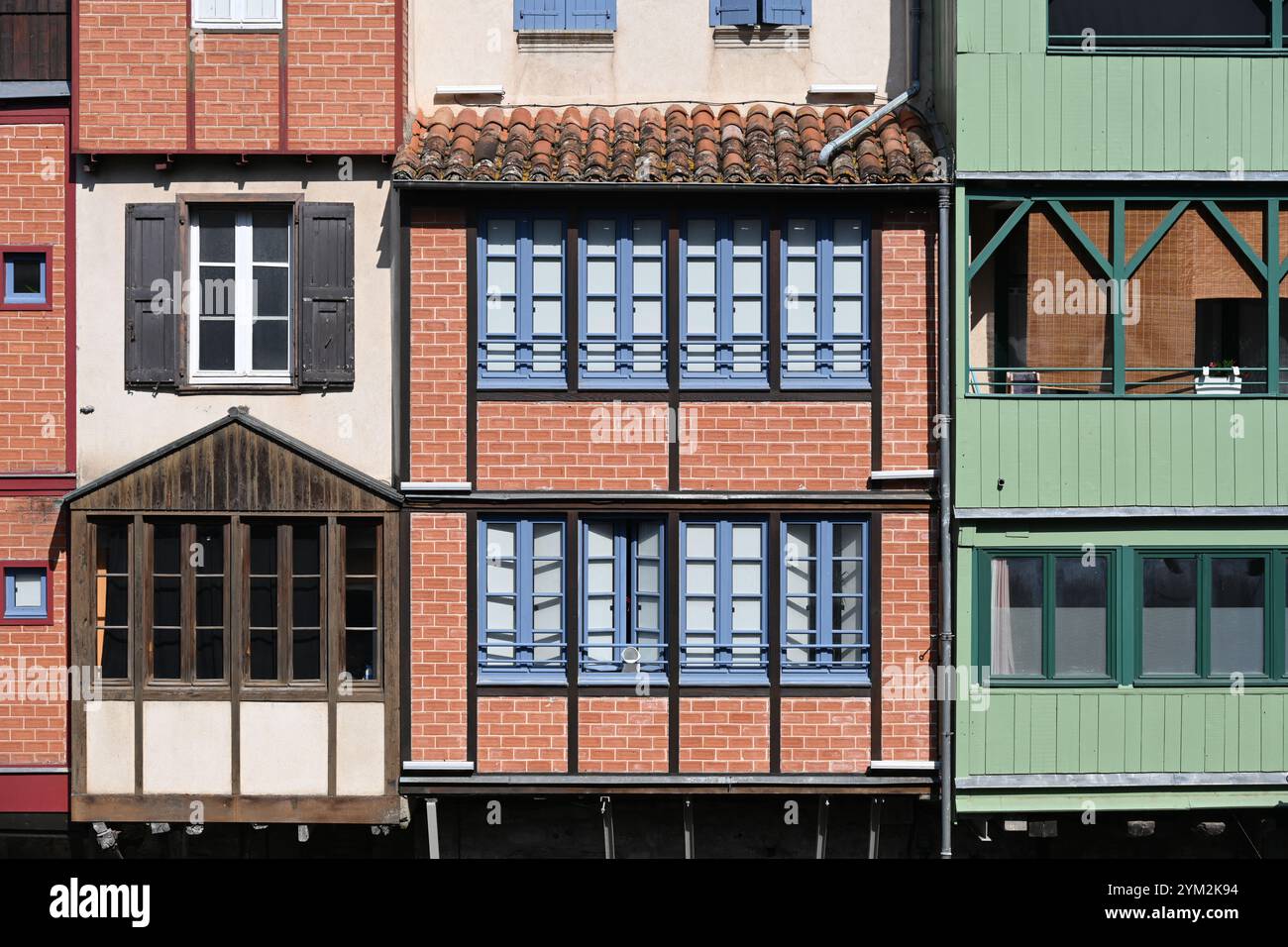 Geometric Window Patterns on Facades of Old Houses, Historic Buildings or Former Dyers Houses on the Quai des Jacobins, Castres, Tarn France Stock Photo
