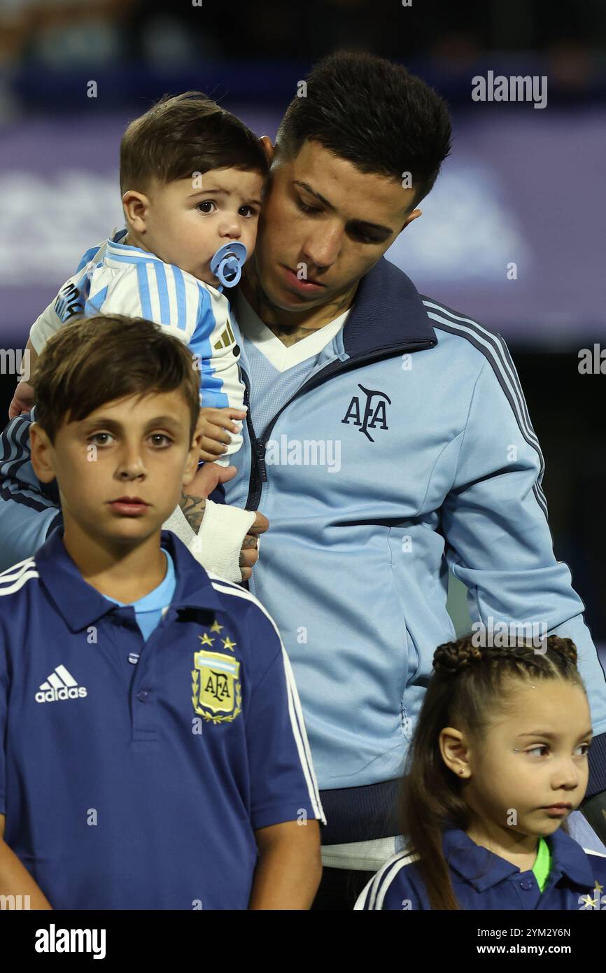 Argentina's midfielder Enzo Fernandez holds up thi son Benjamin before ...