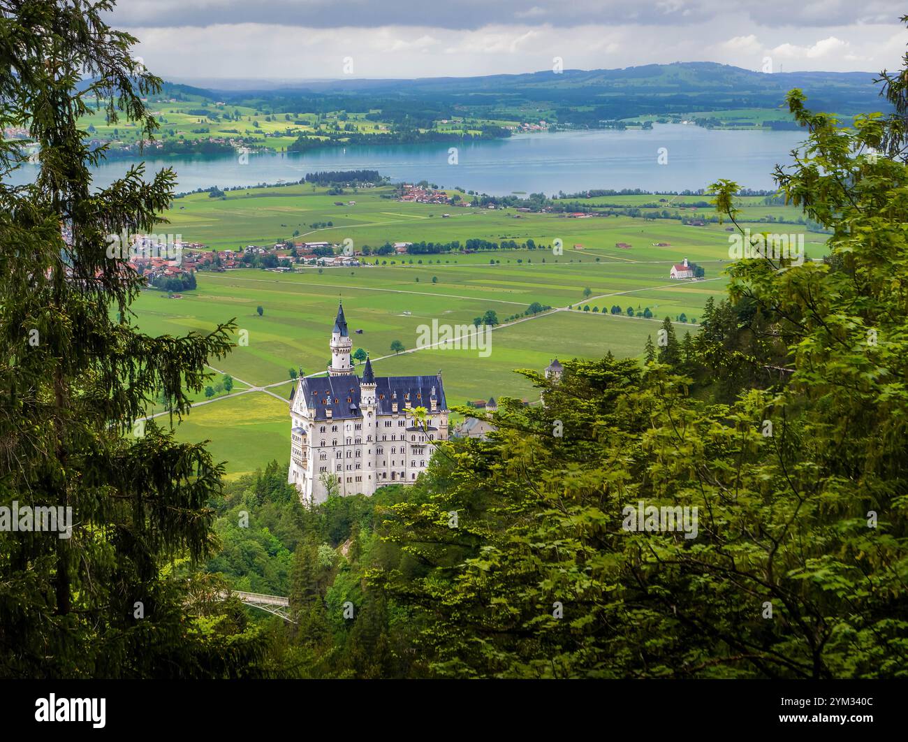 The distant view of Neuschwanstein Castle in Bavaria, Germany with the ...