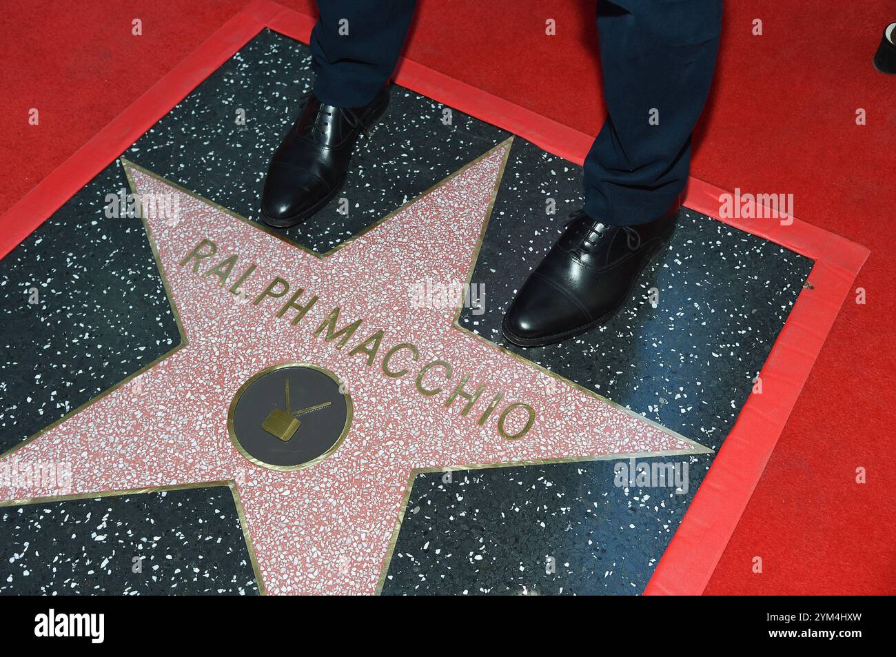 Ralph Macchio is the first to stand on his star during a ceremony