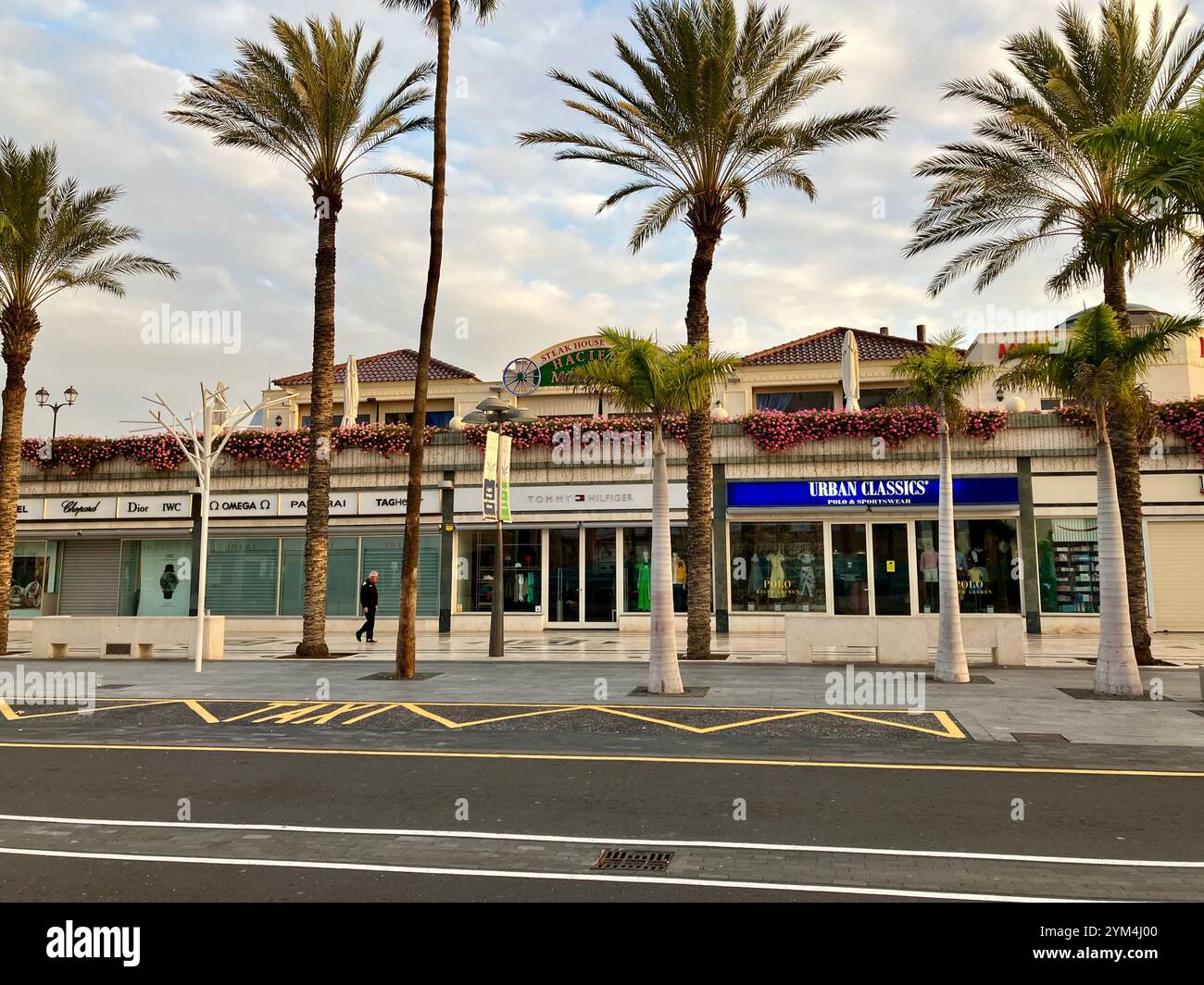 Shops of the Centro Commercial Safari on the Palm Tree lined Playa de las Américas. Arona, Tenerife, Canary Islands, Spain. 4th February 2023. - Smartphone Captured Stock Image