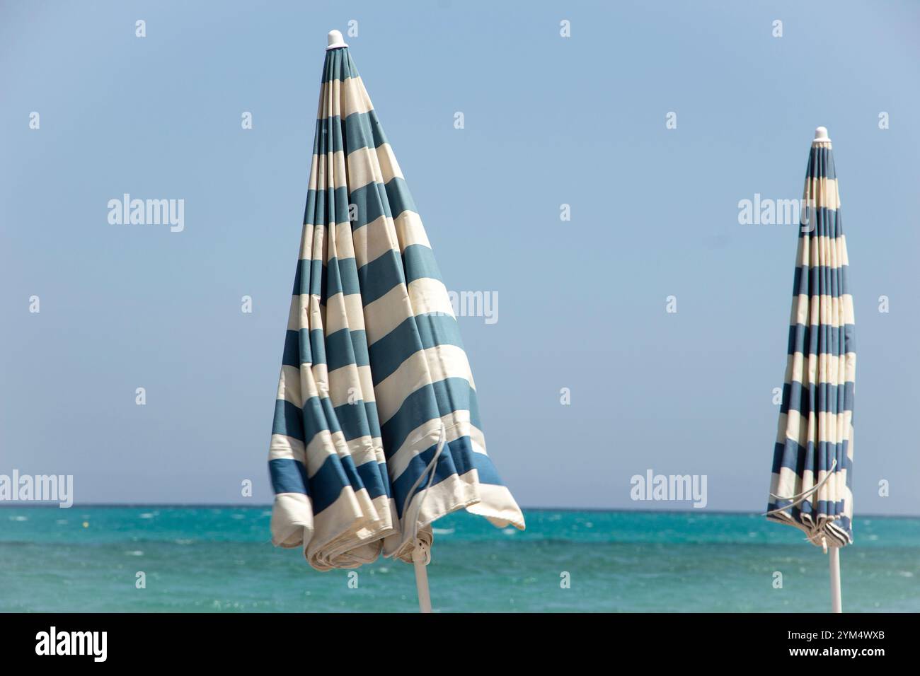 The two vintage blue and white umbrellas Stock Photo