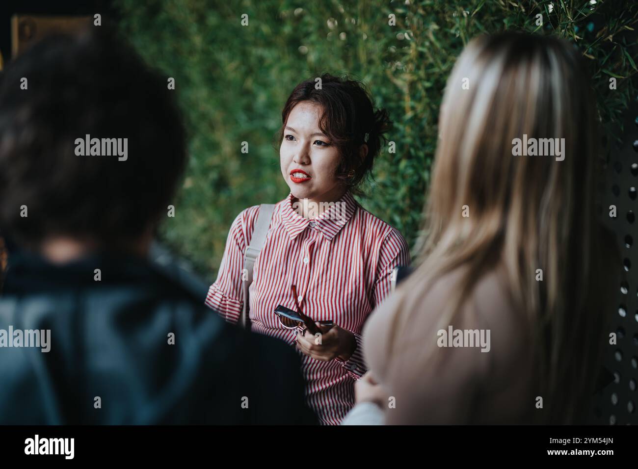 Young professional women having a conversation outdoors Stock Photo