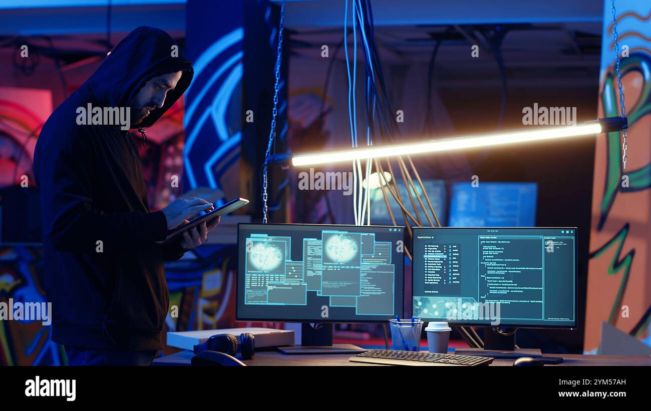 Hacker arriving with tablet in hidden base, deploying viruses on ...