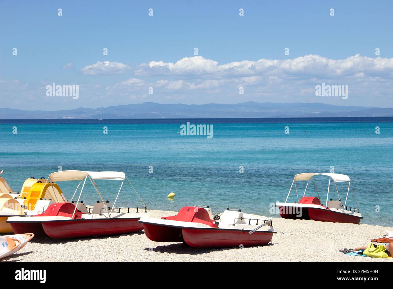 The beach with red pedal boats Stock Photo