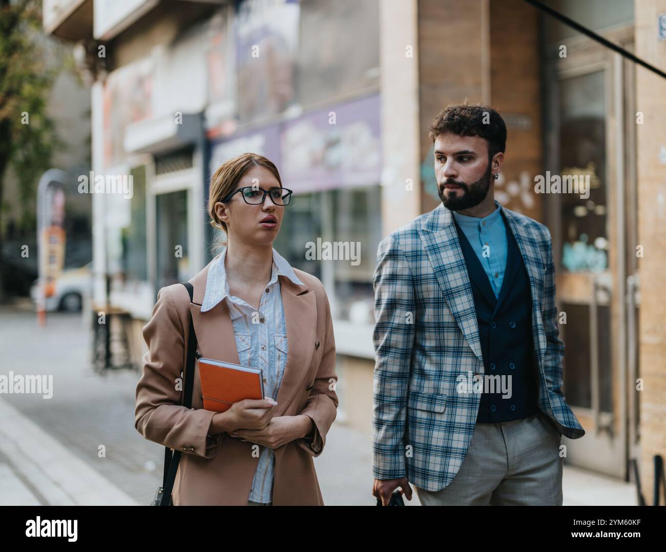Business people having a lively discussion on a city street Stock Photo