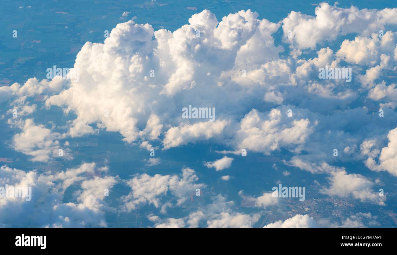 blue sky with a few clouds. The sky is very bright and the clouds are ...
