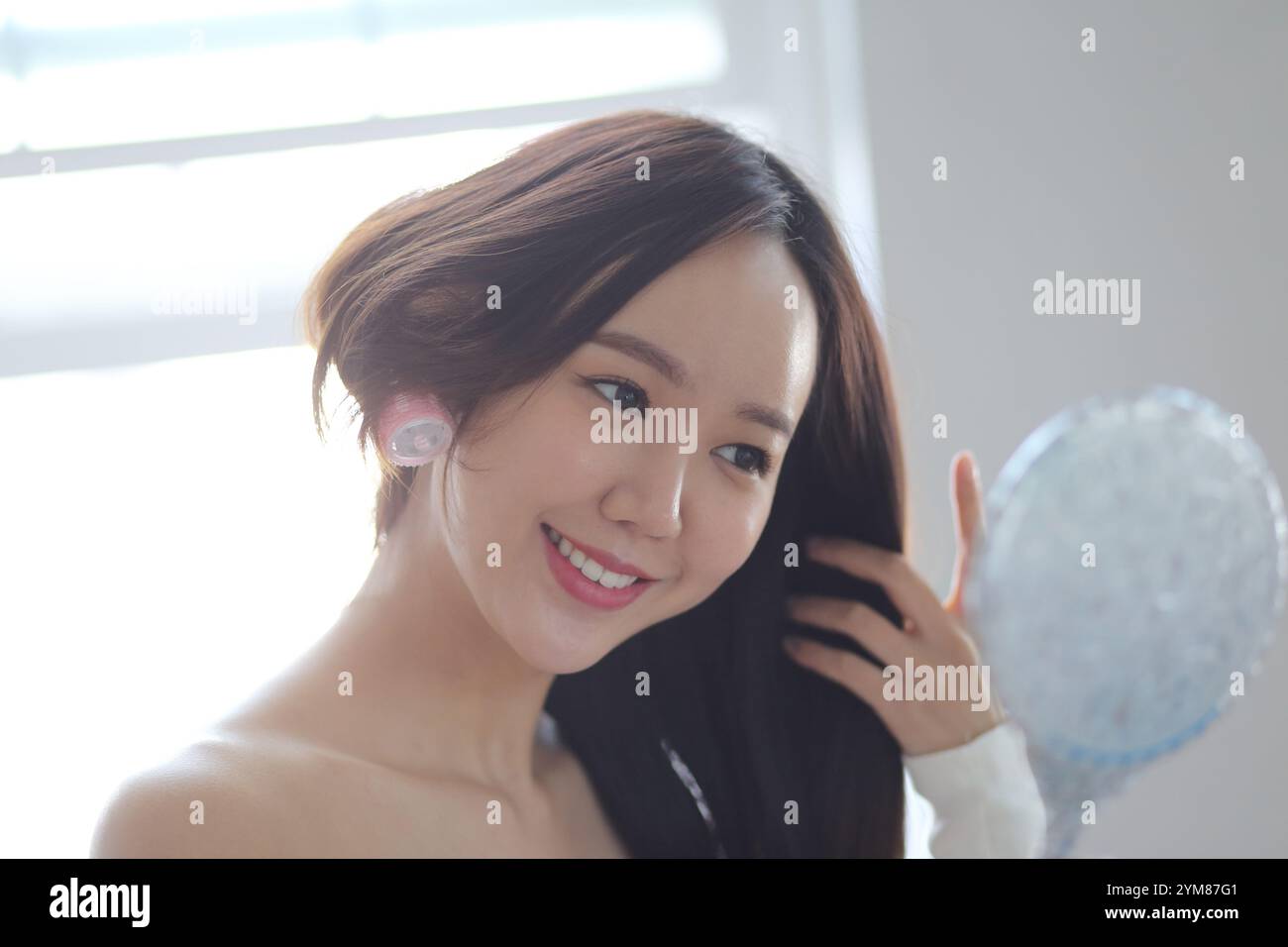 Woman holding hand mirror hi-res stock photography and images - Alamy