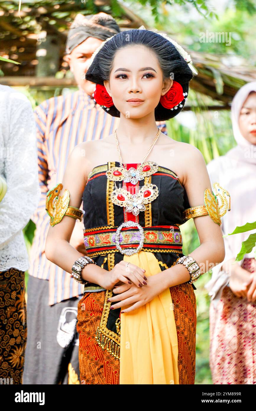 Indonesian with Javanese traditional costume Stock Photo - Alamy