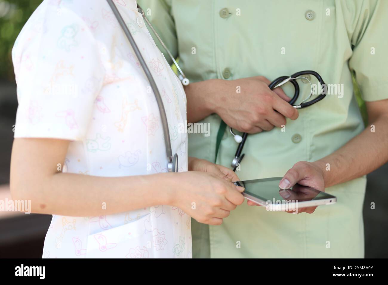 Nurses and doctors consulting using a tablet pc Stock Photo
