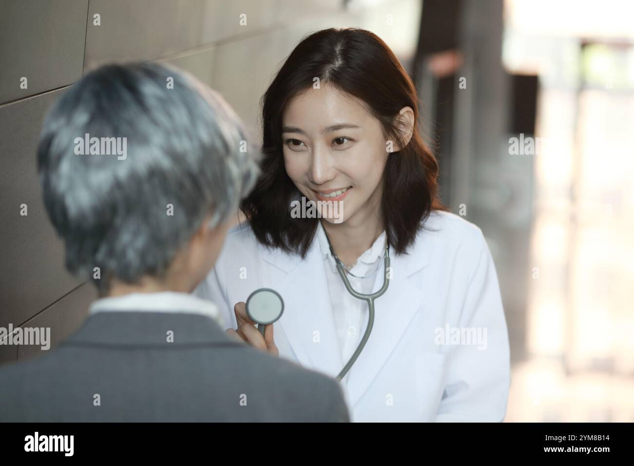 Female doctor examining woman hi-res stock photography and images - Alamy
