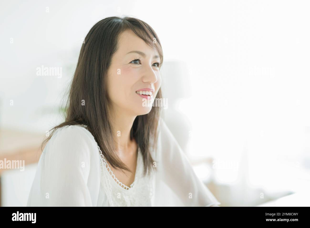 Smiling mature woman in 40s hi-res stock photography and images - Alamy