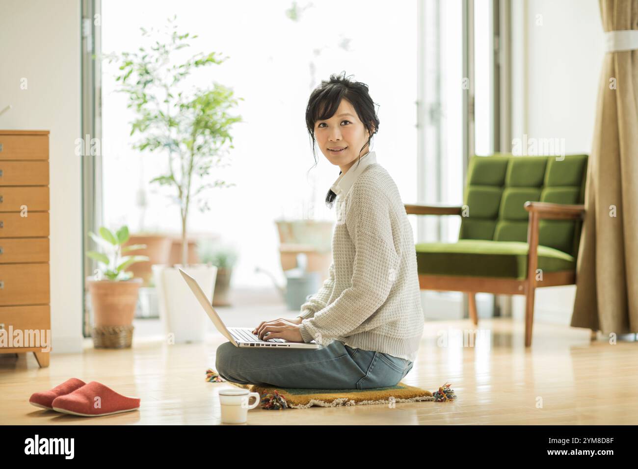 Woman sitting on computer hi-res stock photography and images - Alamy