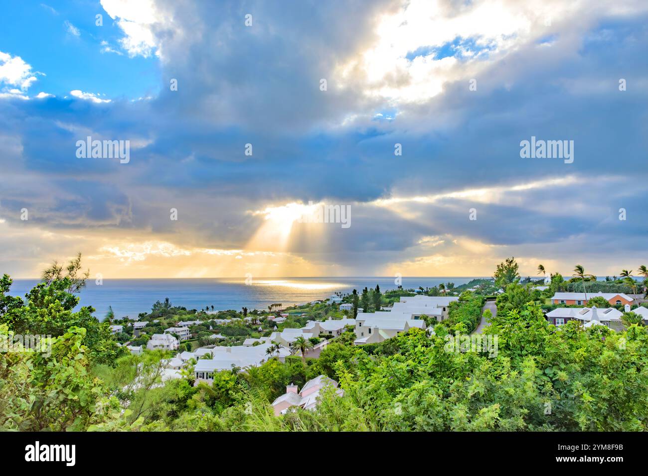 Sunlight Breaking Through Dramatic Clouds Casting Rays on Southampton Parish Bermuda Stock Photo