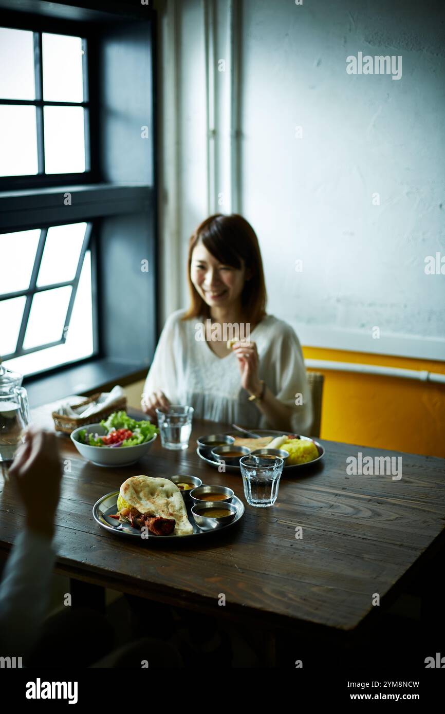 Couple eating curry Stock Photo