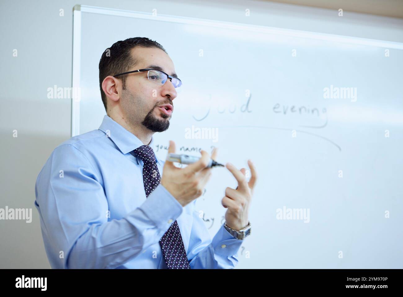 Male teacher teaching English in an English conversation class Stock Photo