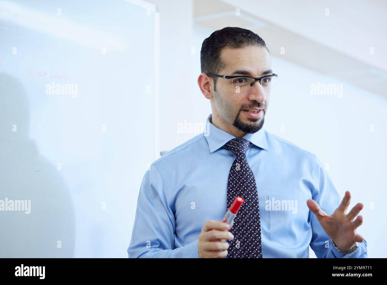 Male teacher teaching English in an English conversation class Stock Photo