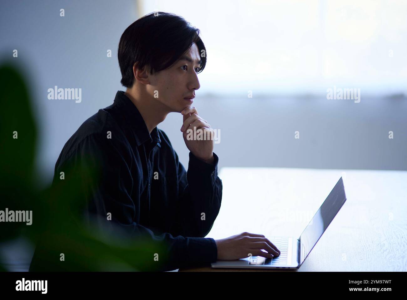 Japanese Man Using Computer Japanese architectural firm hi-res stock photography and images - Alamy