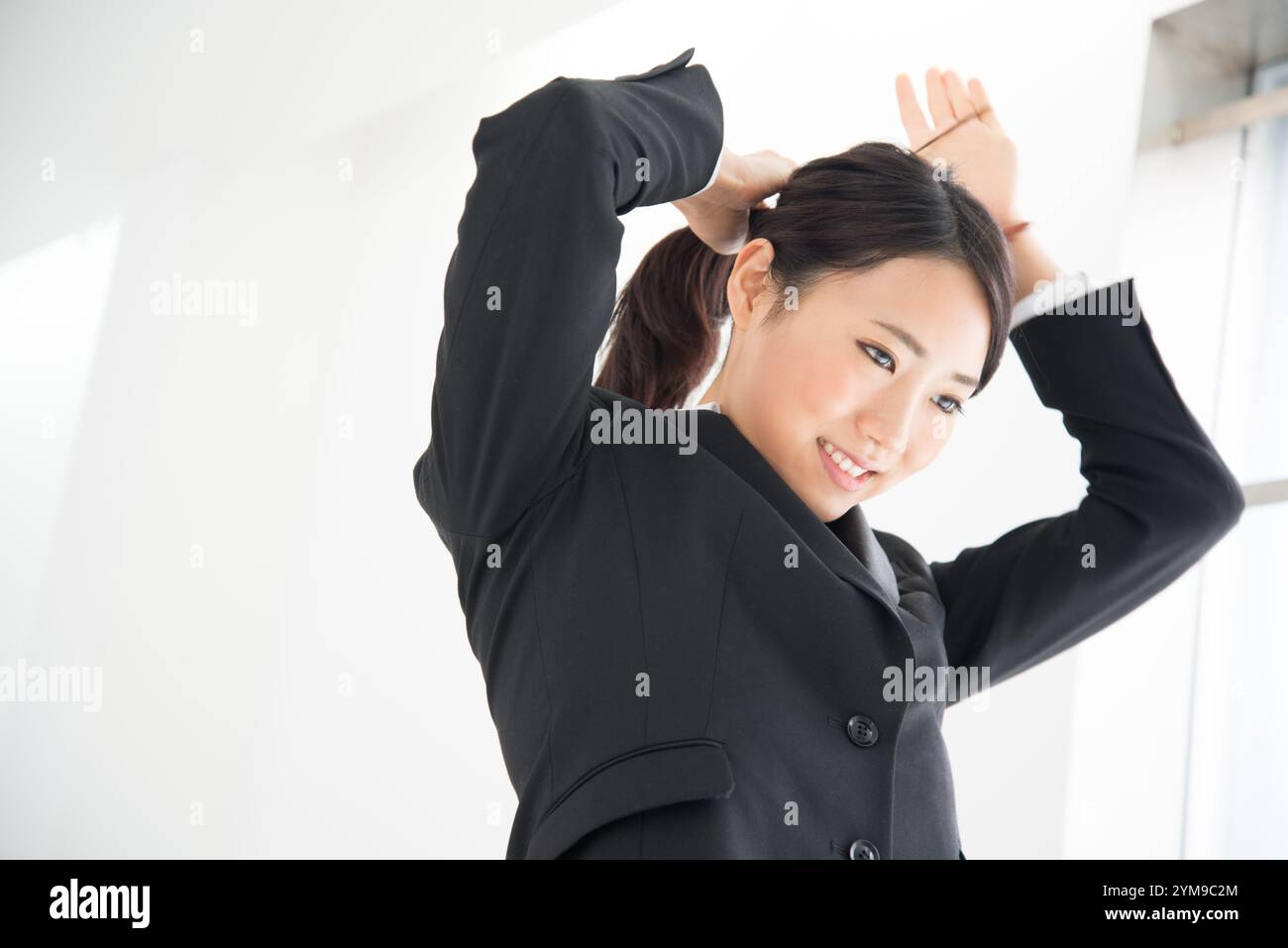 Japanese woman in black suit hi-res stock photography and images - Alamy