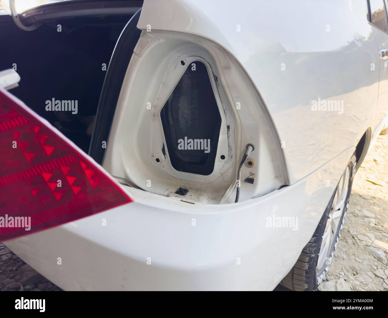 Open rear light assembly of a white car for repair Stock Photo - Alamy