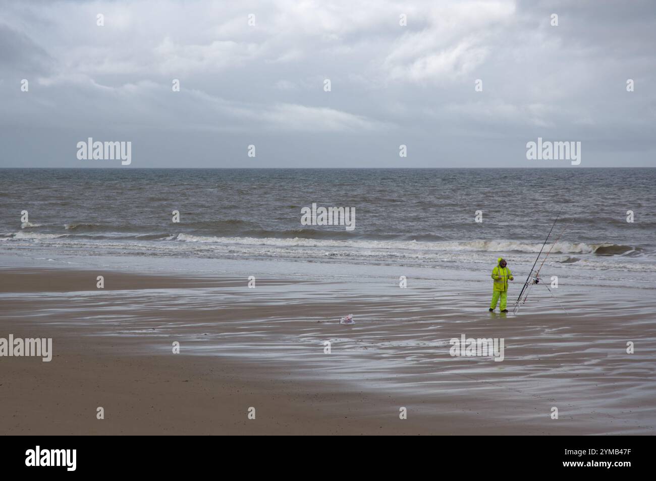 Winter angler on a North Norfolk beach Stock Photo - Alamy