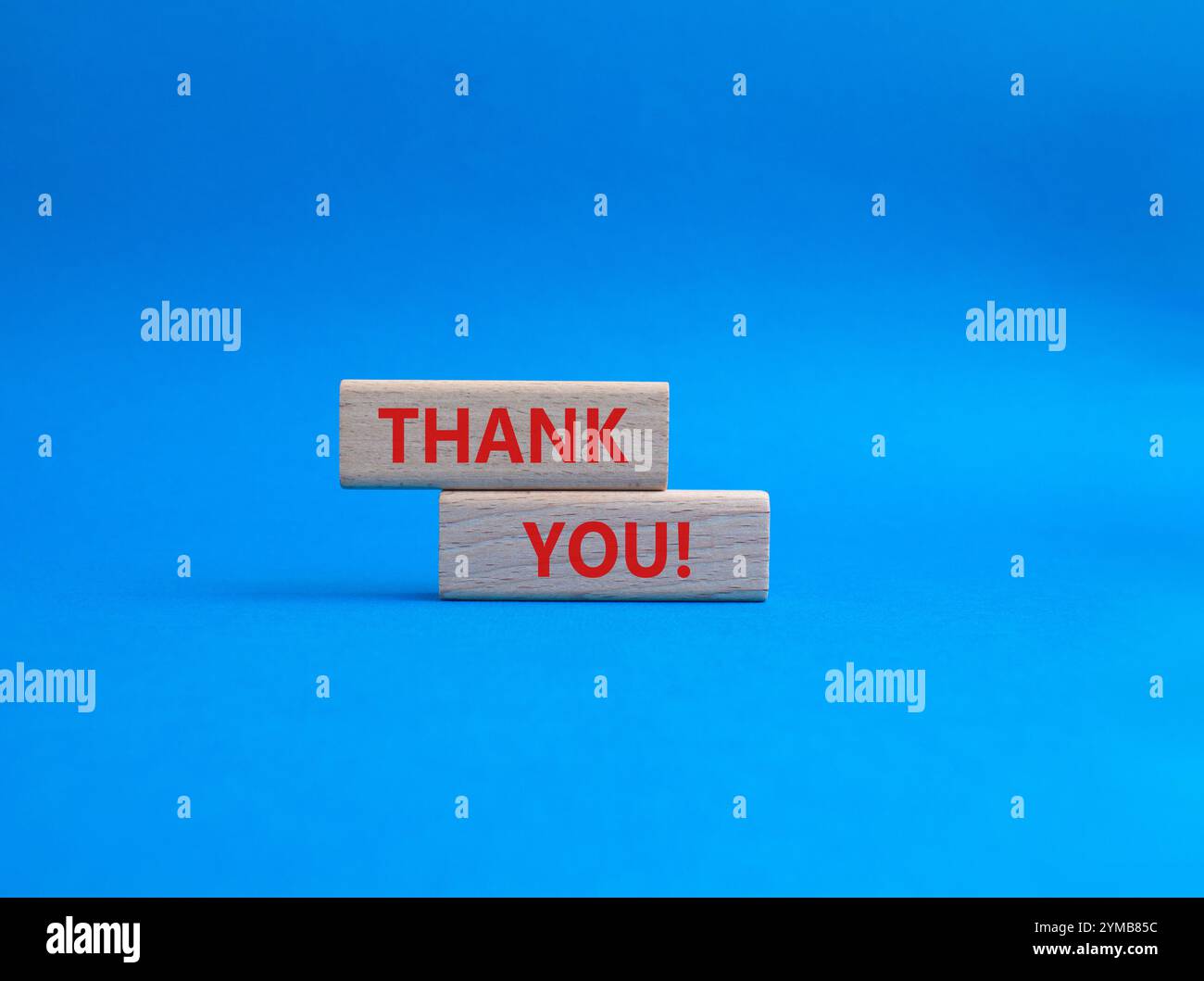 Thank you symbol. Wooden blocks with words Thank you. Beautiful blue ...