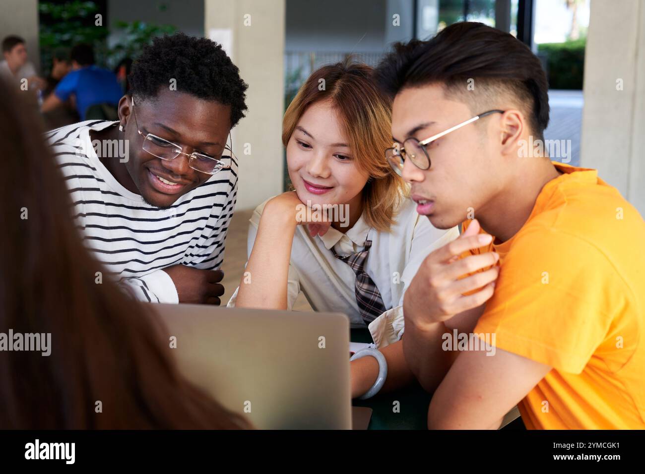 Group people sitting table in hi-res stock photography and images - Alamy
