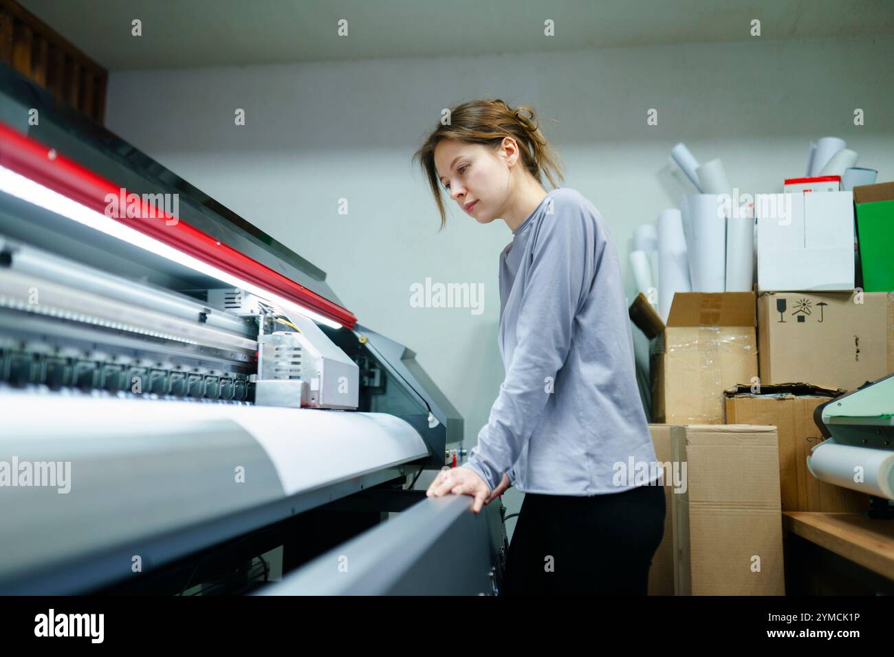 Woman working in printing studio Stock Photo