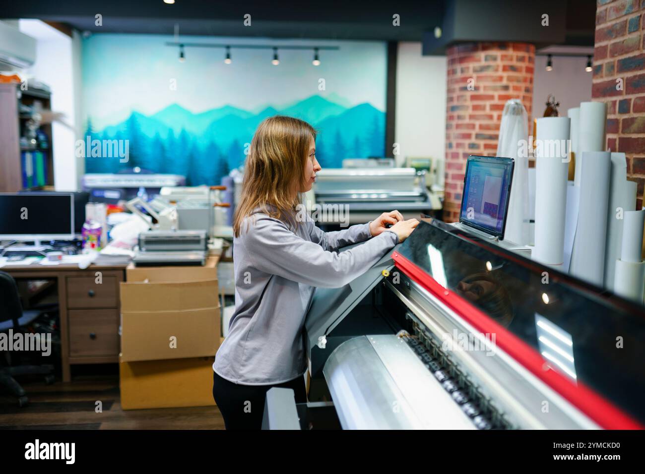 Woman working in printing studio Stock Photo