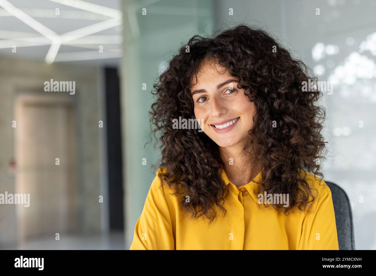 Happy hispanic female curly hi-res stock photography and images - Alamy